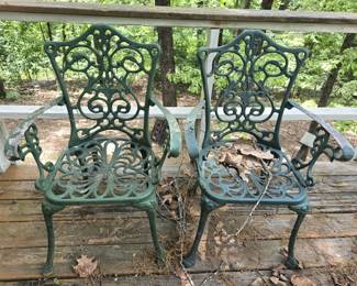 Pair of green metal chairs
