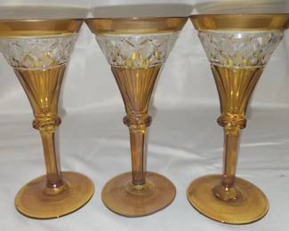 Lot of 3 amber colored crystal champagne glasses
