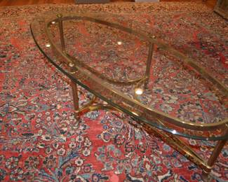 brass and glass oval coffee table and 18x15 rug