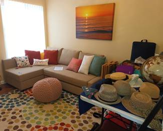 Corner sofa, decor and hats