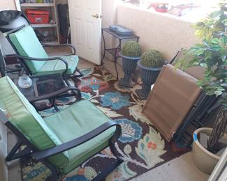 Patio rockers, folding chairs and fake plants