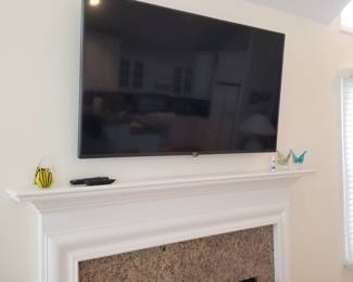 Flat screen TV with wall bracket