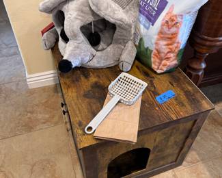 fancy kitty litter box, cat bed that looks like a rat, kitty litter and scooper