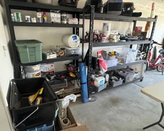 lots of cat carries in clean and good condition, painting supplies, Christmas lights, paint, hummingbird feeding supplies, camping table. 