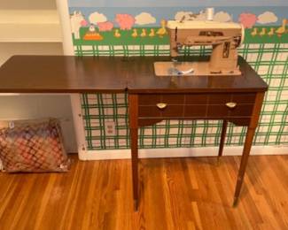 Vintage sewing machine in table