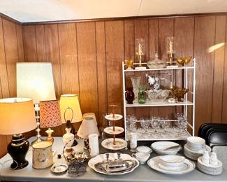 Tables full of china, crystal, lamps, decor.