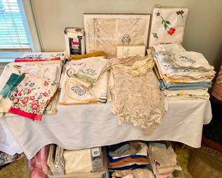 Table full of vintage linens.