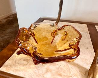 Amber glass dish.