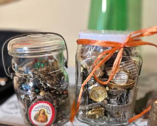 Jar of watches and jewelry.