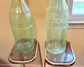 Iconic Coca Cola bottle banks.