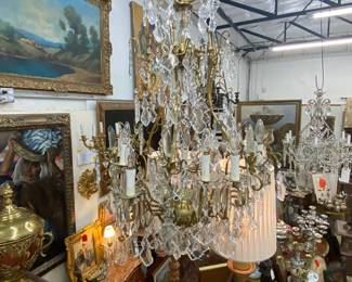 A pair of large, matching crystal chandeliers