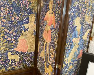 A very heavy, three panel mahogany and tapestry room divider