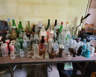Lots of vintage bottles, soda and medicine. 