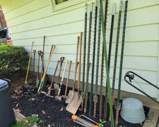 Hand garden tools, axes shovels and sledge hammers.