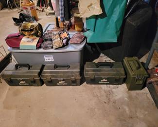 Some boxes with gun supplies and cleaning equipment. 