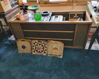 Zenith stereo cabinet with record player. Record player needs some work, but the cabinet is beautiful and the stereo works great!