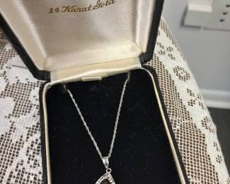 14k white gold garnet and diamond pendant necklace.