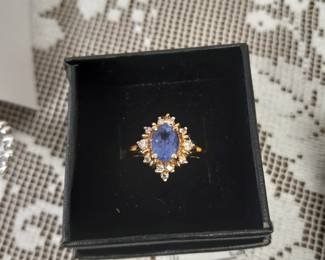 14k gold blue tanzanite diamond ring.