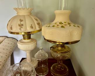 several Victorian hurricane lamps
