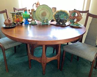 Unique MCM dining table with matching chairs. (The chairs need to be reupholstered) 