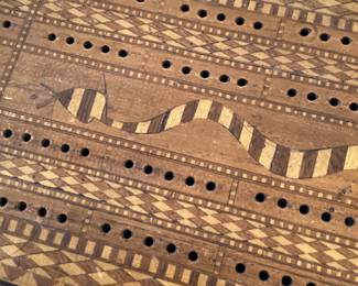 Inlaid snake cribbage board