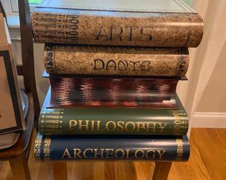 Table of books resting on a chair