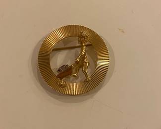 Very fun gold person pushing a wheelbarrel pin 