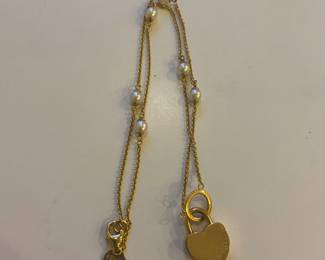 Tiffany gold necklace with iconic heart padlock