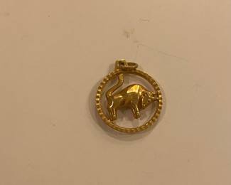Small gold bull pendant