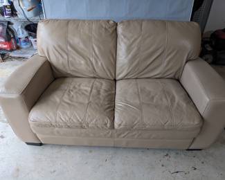 BUY IT NOW: Light Brown Leather LoveSeat. Good Condition and comforatable. Asking $85 or OBO.