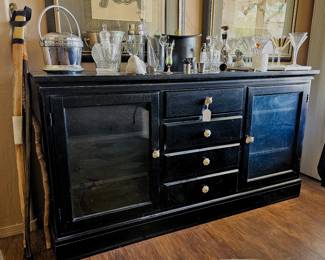 Black console with drawers and display case storage 
