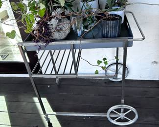 Bar cart with removable tray . Can be used as a plant stand too - crate and barrel 