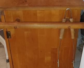 Nice butcher block cabinet with slide out cutting boards one side for knives one side for utensils opens up has nice storage and storage racks on the inside of the doors