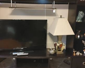 New modern Black Entertainment Center would hold huge flat screen TV