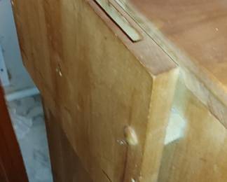 Nice butcher block cabinet with slide out cutting boards one side for knives one side for utensils opens up has nice storage and storage racks on the inside of the doors