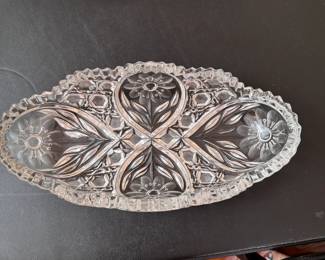 Pressed glass dish with floral pattern in teardrops and honeycomb border, and sawtooth edge 10"L