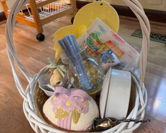 White basket of Easter-themed items 