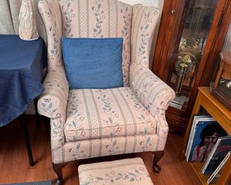 Tan floral wingback chair and footstool, some wear 30"W