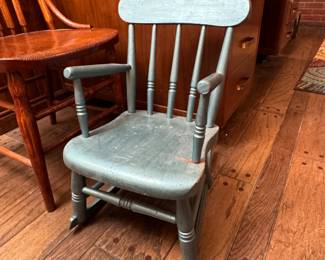 Blue wooden child's rocker, some wear 21"H x 13"W