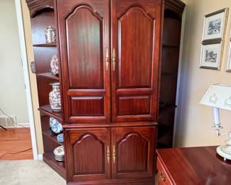 Three-piece storage cabinet with central armoire and two corner shelves, the cabinet has retractable top doors is 6'4"H x 36"W 26"D, each corner cabinet is 22"W