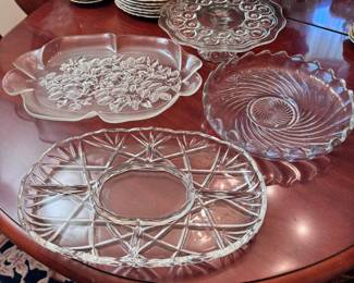 Grouping of large clear glass trays and cake stand, the largest stray is 16"L