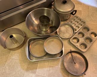 Group of vintage baking pans, pot, sifter, and large mixing bowl