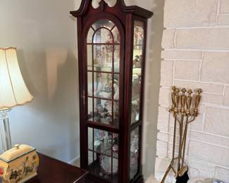 Cherry lighted curio cabinet with glass shelves, some wear to front 6'5"H x 26"W x 15"D