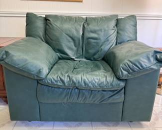 Green vinyl overstuffed chair, some wear overall 34"H x 46"W x 32"D (This item is heavy & downstairs)