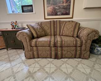 Tan loveseat with green and burgundy stripe, some wear and needs cleaning 30"H x 5'6"W x 3'2"D (This item is heavy & downstairs)