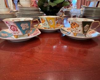 Vintage paneled footed teacups and saucers, hand-painted floral with gold decoration