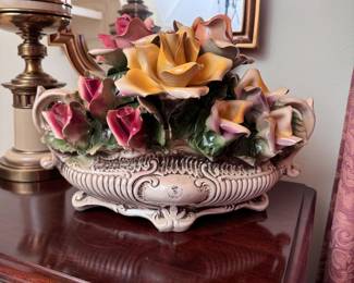 Monumental Capodimonte porcelain floral arrangement has a minor chip on one leaf, 11"H x 15"W