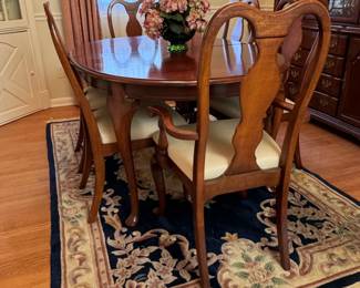 Lazarus oval dining able, fabric seats have some spots, fine spots on top and two plate-sized heat spots, 64"L x 44"W as seen, table pads and two leaves 15"W each included