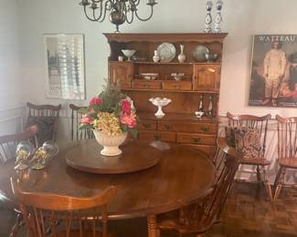 10 chairs and two leaves included for this pristine table