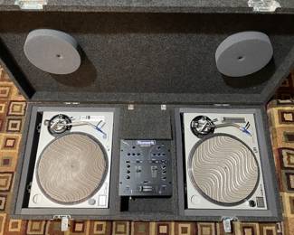 Two side by side Technics Quartz- Direct Drive Turntable System  SL-1200MK2 with DM1001x DJ Mixer. Ready for your DJ gig together with this heavy duty travel case. Very well kept equipment indeed!